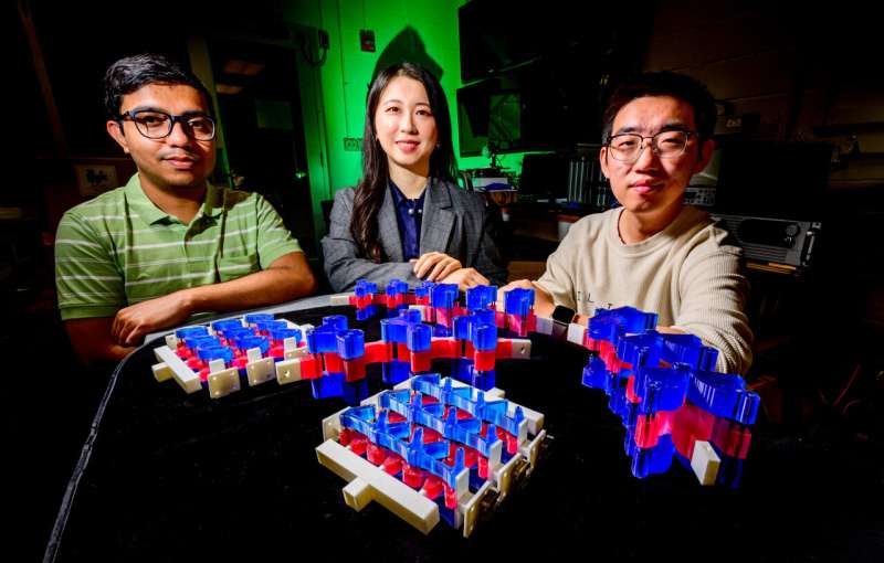 Illinois Professor Shelly Zhang and her team have developed a versatile synthetic multilayered material. This innovation is expected to revolutionize applications from car bumpers to wearable bandages. Credit: Fred Zwicky Study finds that individual layers of synthetic materials can collaborate for greater impact
