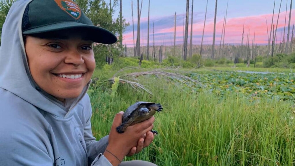Sidney Woodruff holding a northwestern pond turtle
