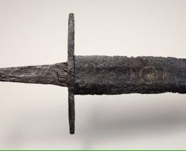Unearthed Legacy: A 1,000-Year-Old Sword Adorned with Sacred Symbols Reveals Ancient Secrets in Dutch River Exhibition