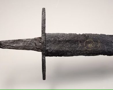 Unearthed Legacy: A 1,000-Year-Old Sword Adorned with Sacred Symbols Reveals Ancient Secrets in Dutch River Exhibition
