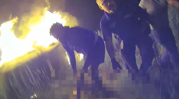 Heroic Rescue: Officer Bravely Shatters Flames to Save 68-Year-Old Woman Trapped in Burning Car