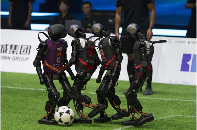 Teams compete using the T1 robots from Booster Robotics during the inaugural RoBoLeague robot soccer competition held in Beijing, Saturday, June 28, 2025. Credit: AP Photo/Ng Han Guan China's humanoid robots generate more soccer excitement than their human counterparts