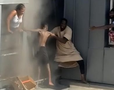 Heroic Climb: Man Risks Life on 6th Floor Ledge to Save Family from Fiery Tragedy