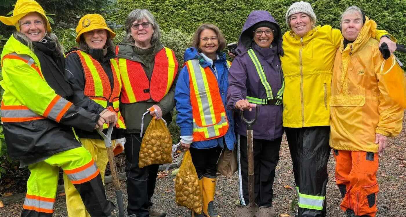 Marilyn and her friends planting daffodils